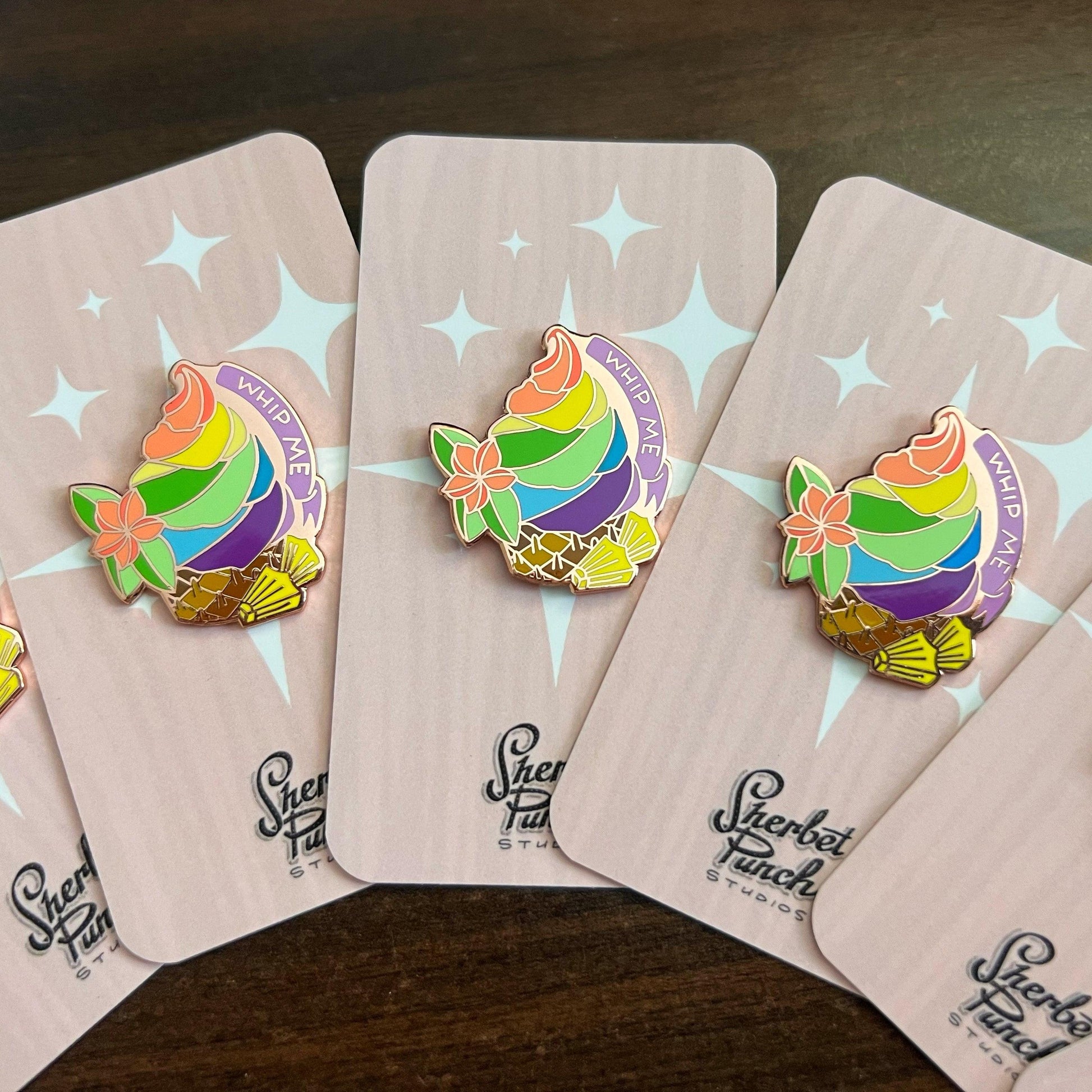 Whip Me enamel pins rainbow colored